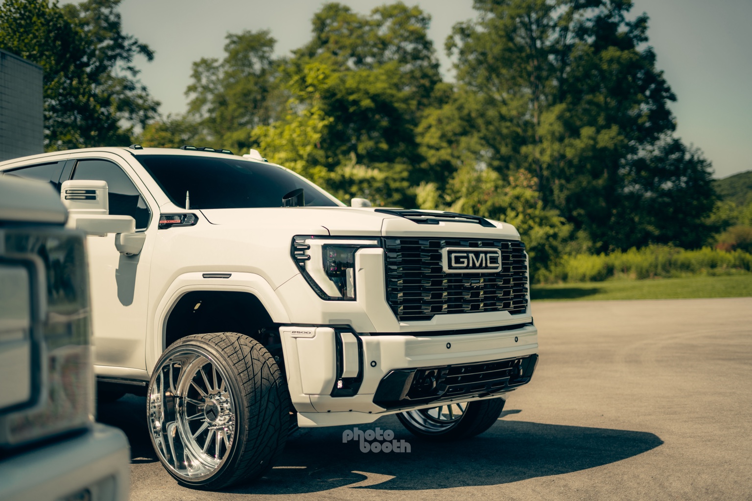 White GMC truck with custom branding